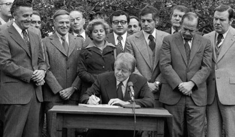 President Jimmy Carter signs the Community Reinvestment Act into law in 1977.