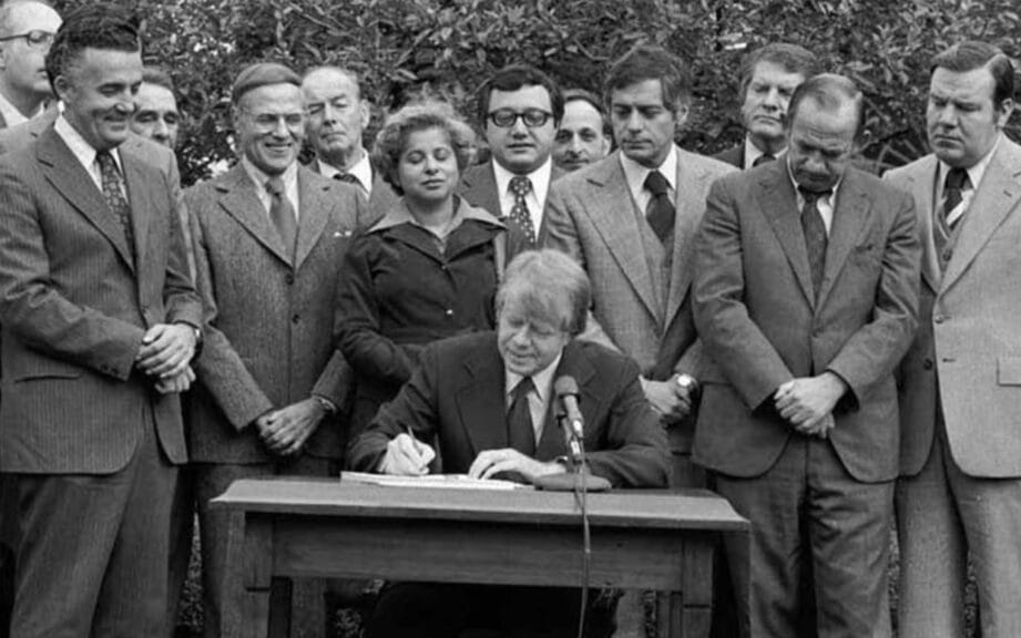 President Jimmy Carter signs the Community Reinvestment Act into law in 1977.