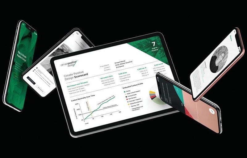 Several computers and laptops display different climate positive design apps.