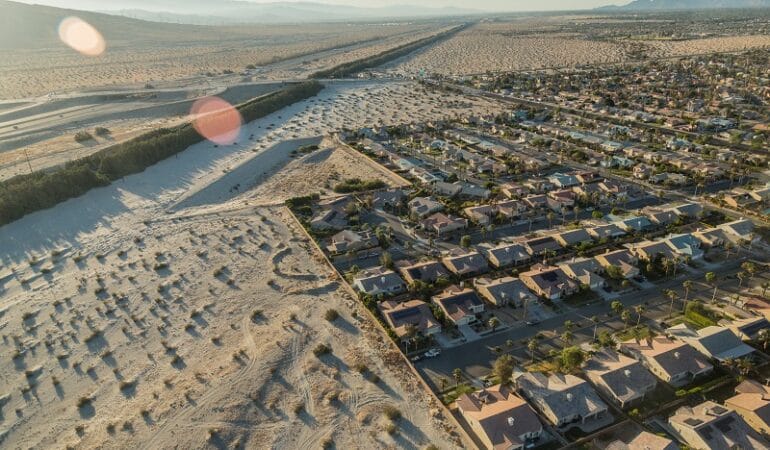 An aerial shot of rows of houses in the Coachella Valley.