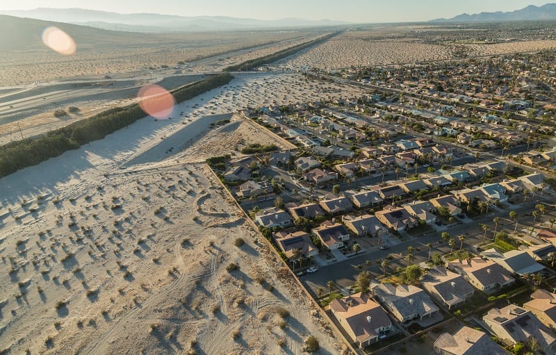 An aerial shot of rows of houses in the Coachella Valley.