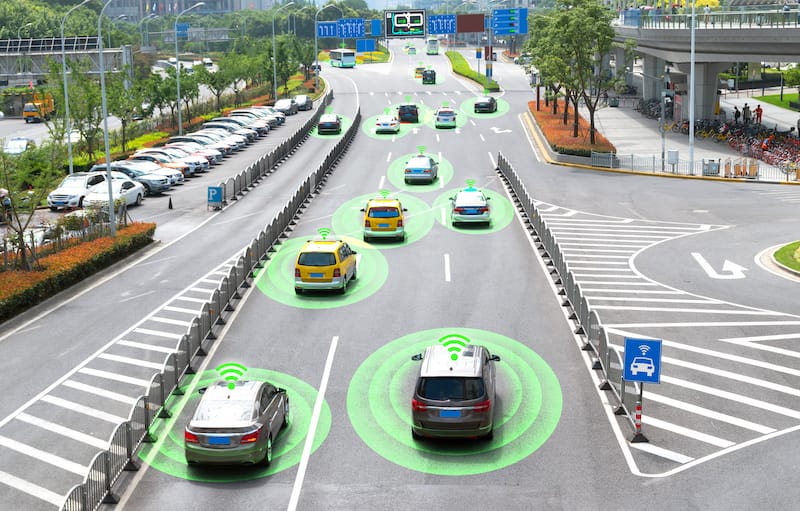 Autonomous self-driving cars on a metro city road.