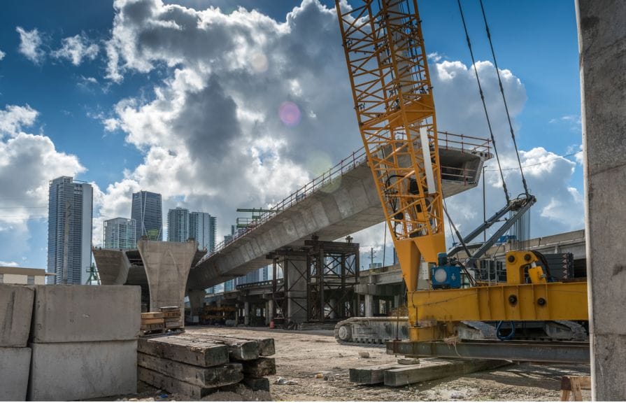 Construction of a bridge in downtown Miami. Credit: CHUYN via istock/Getty Images Plus.