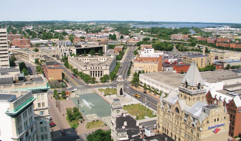 Aerial view of Syracuse showing a municipal park and buildings