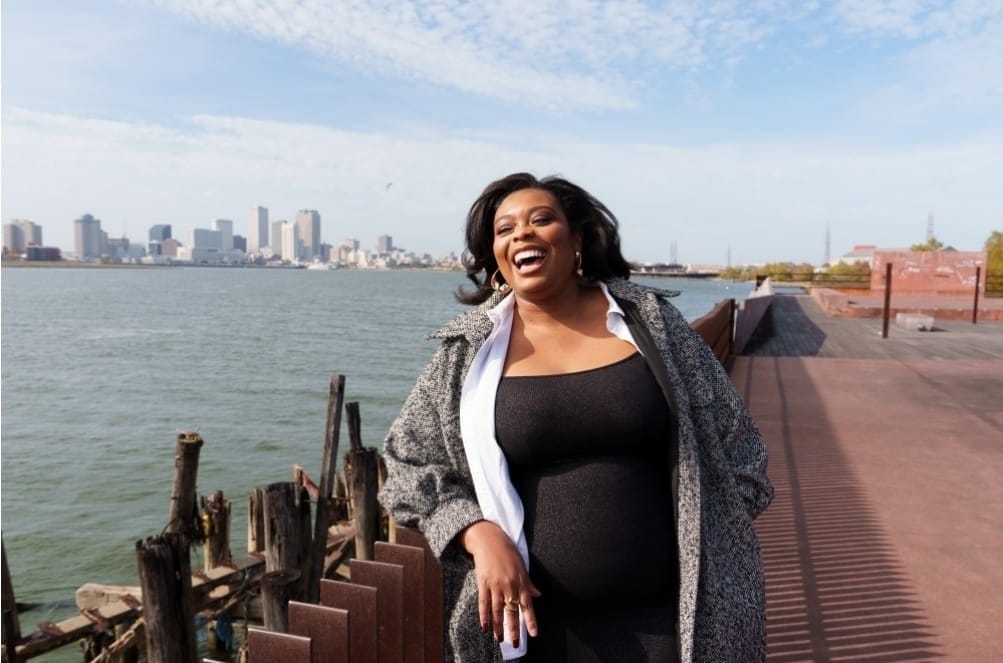 Portrait of Jessica Dandridge-Smith with the New Orleans skyline visible in the background.