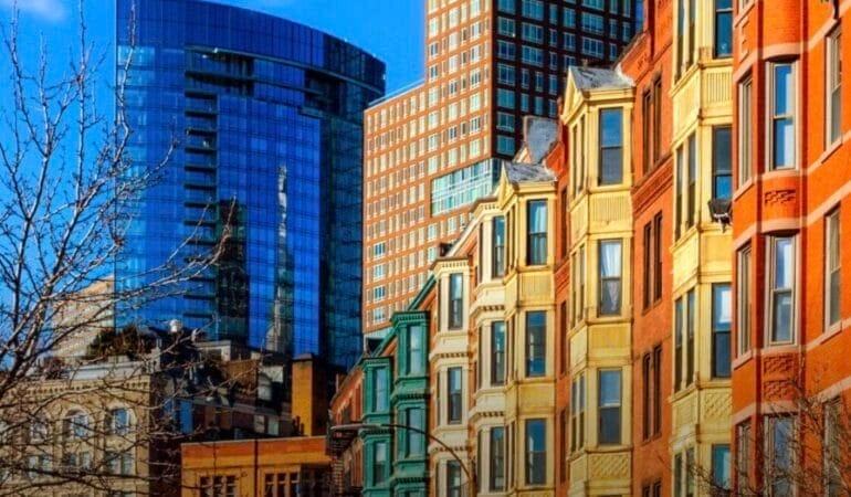 Photo of the exterior of a row of buildings on a street in the Back Bay neighborhood of Boston.