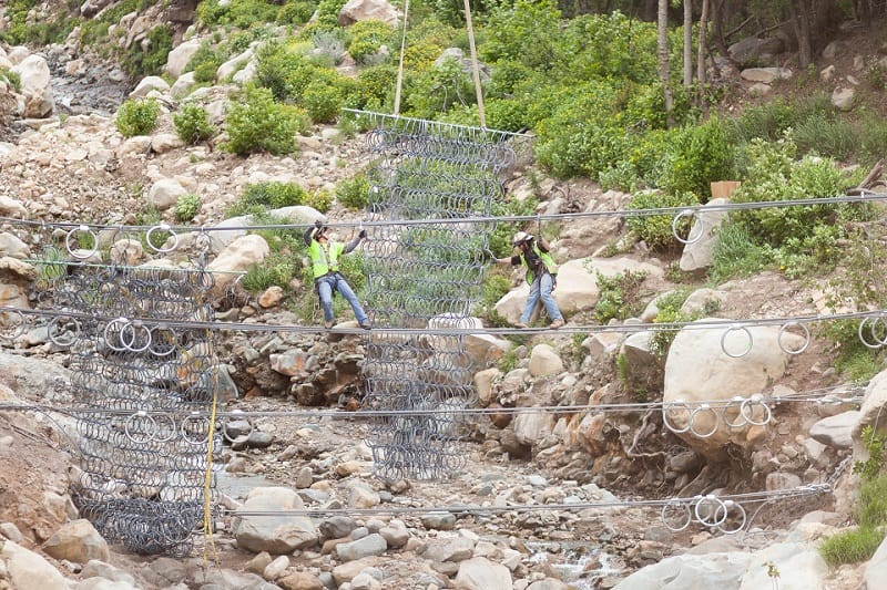 Installation of flood control net in Montecito, CA