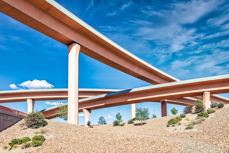 The construction and management of major infrastructure projects like highways, such as this interchange in Albuquerque, New Mexico, requires cooperation between federal and state governments.